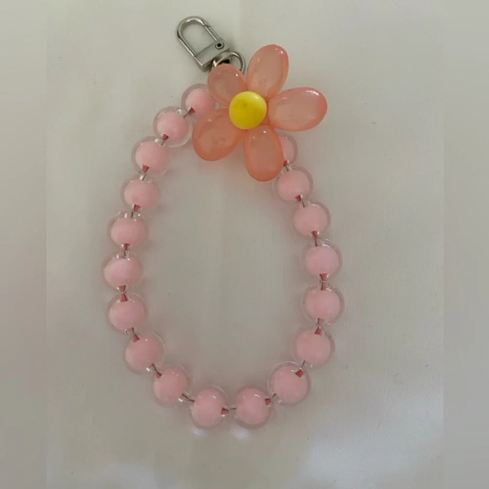 1-wrist lanyard for cells, keys and more Pink Oversized Flower Charm